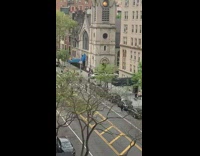 Guy american flag sings microphone blue awning 