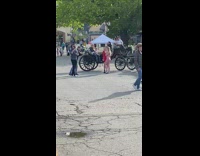 Guy panorama shot girls and horse carriages
