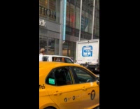 Guy rides bike pulls luggage on road