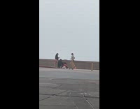 Woman in rollerblades tiktok dance on sidewalk