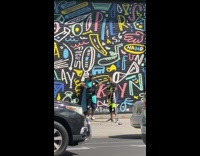 Group of men takes video along the street in new york 