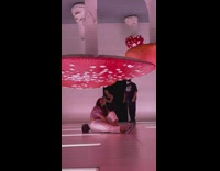 Woman sit pose under upside down mushrooms