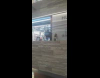 Woman beige coat crouch and leaned Huawei Wall