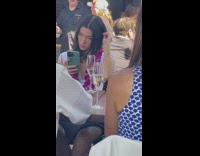 Woman with a lei selfie on the restaurant