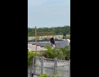 Two women dances at resort while it rain