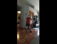 Little boy in red shirt playing with oculus VR headset 