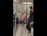 Person twerking on subway train floor 