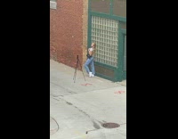 Girl jeans black bag alley grid window