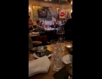 Four people eats food with camera flash