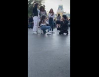 Guy poses with food at Disneyland 
