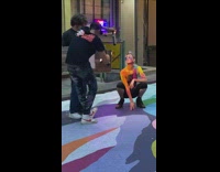 Lady rubs colorful powder on body pt. 2