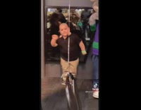 Little boy dances with chuck e cheese mouse