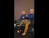 2 brothers bite each other 