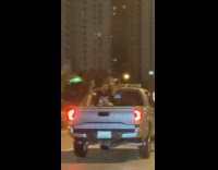 Man selfie video back of pickup truck