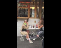 Two Models Poses with Food at Outdoor Dining 