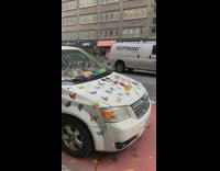 White van has stickers and toys 