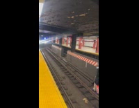 Homeless man shouts at the subway train