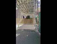 Collab WINY - Blue car stuck on sidewalk stairs 