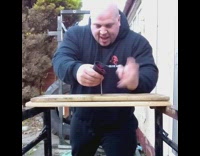 Bald Guy Headbutts Nail Until it Goes Through Wood 