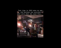 Crowd cheers at woman singing Anaconda karaoke