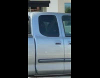 Girl tiktok dances by black convertible car 