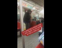 Guy plays clarinet on subway 