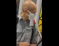 Guy wears scream costume face mask 