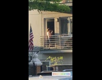 Shirtless guy black electric guitar balcony 