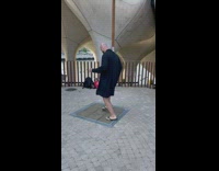 Guy plays music by stepping on squares 