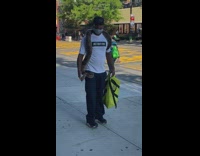 Guy large black brown snake around shoulders 