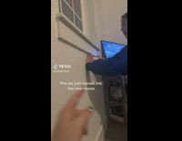 Girl throws game controller by accident into wall