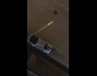 Two poeple fight near truck 