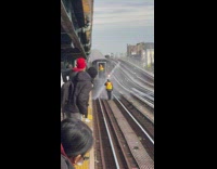 Broken pipe squirts water in way of oncoming subway