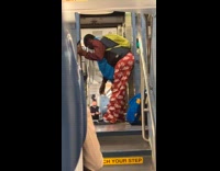 Guy wears vest tweaks on train ride