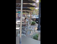 Man films himself eat food on sidewalk