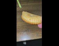 Bent Ritz Cracker biscuit filmed by filmer