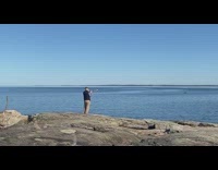 Guy blows into shofar first spring day  