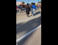 Collab IITW - Woman in brown jacket and cowboy hat poses at the carnival Part 1