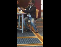 Man takes selfie with food at conference party