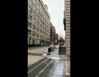 Girl poses on white SUV roof street