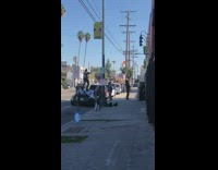 Guy dances on parked black sports car
