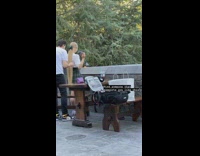 Man brush long blonde hair of girl