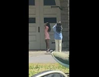 Woman pink dress pose near white door part 2