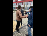 Teacher handshakes with a student in a cool way