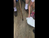 woman drops cake during pic