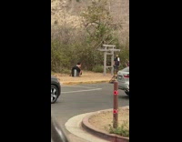 Woman black pants sit television photo shoot