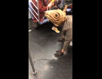 Red jacket guy runs from rat costume