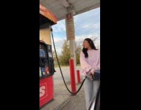 Single woman filling up her own tank 