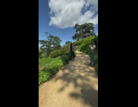 Girl in park flipping hair jumping around