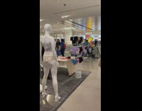 Drummers march in shopping store 